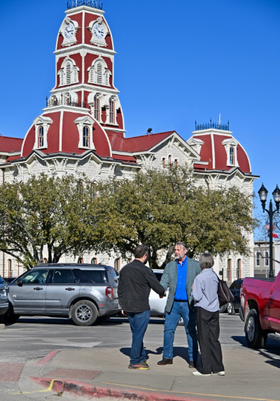 image of Henry Lee Butler with community members.